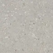 Ceppo di Gré porcelain stoneware texture with light gray base, mottled granular pattern, and embedded white, beige, and brown fragments.